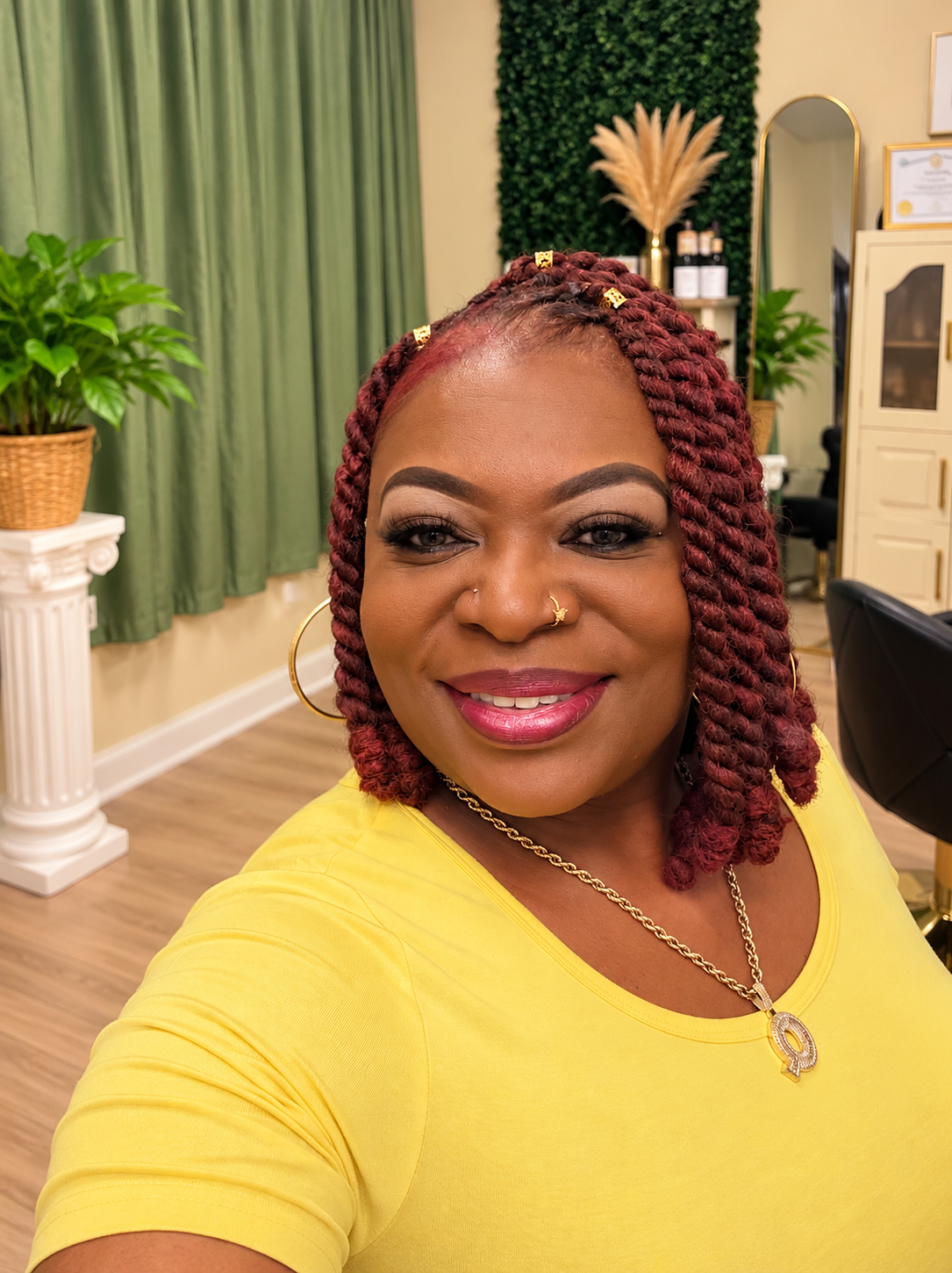 Client with burgundy braids
